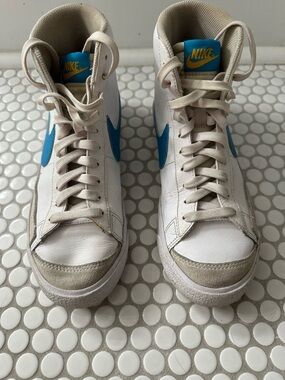 Nike White High-Top Sneakers with Blue Swoosh and Teal Tongue Patch